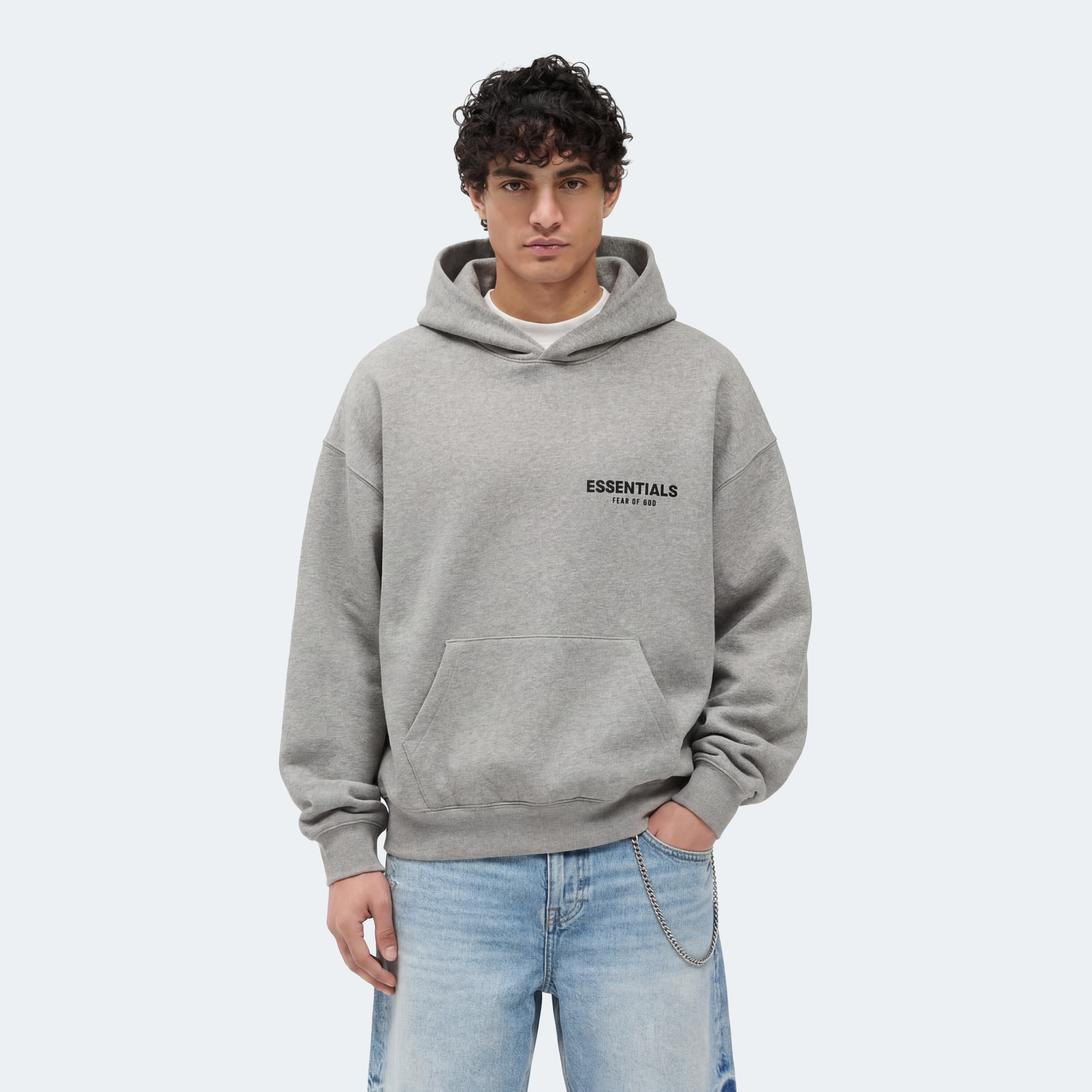 Male model wearing Essentials Dark Oatmeal hoodie