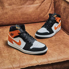 Air Jordan 1 Mid Shattered Backboard, Black/Starfish-Starfish-White (554725-058)